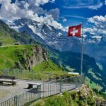 A Viewing Deck with Swiss Flag in Grindelwald, Switzerland,