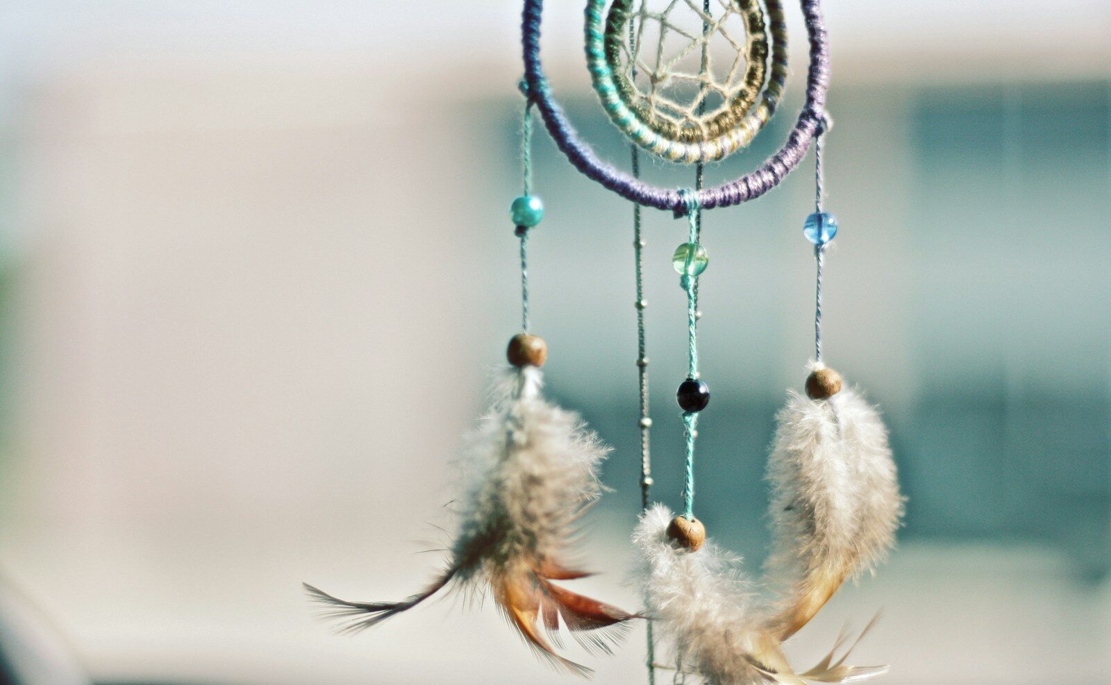 selective focus photography of multicolored dream catcher