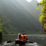 group of people on boat paddling during daytime