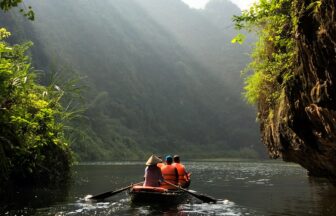 group of people on boat paddling during daytime