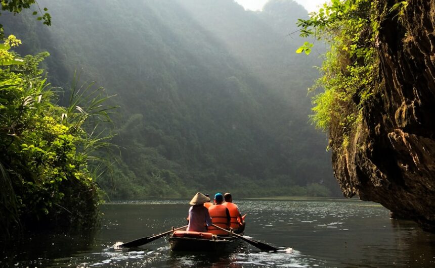 group of people on boat paddling during daytime
